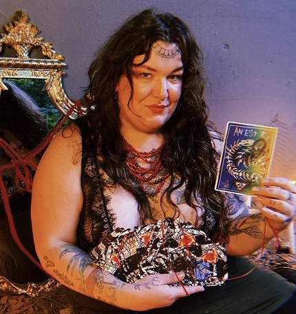 Ylva holds the Living Altar Oracle Deck